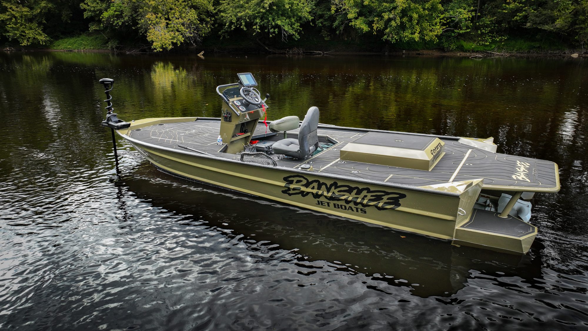 The SR 72 Inboard Jet at rest on a calm, tree-lined river