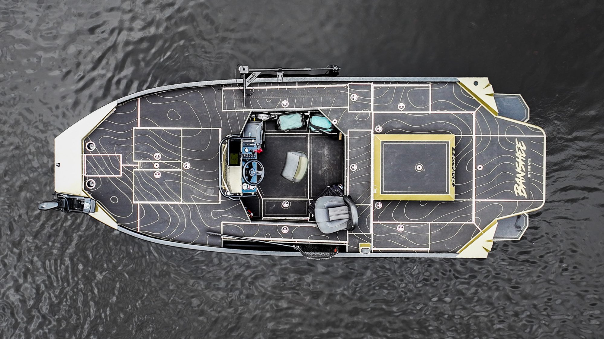 A green Banshee jet boat seen from directly above, showing the full deck layout