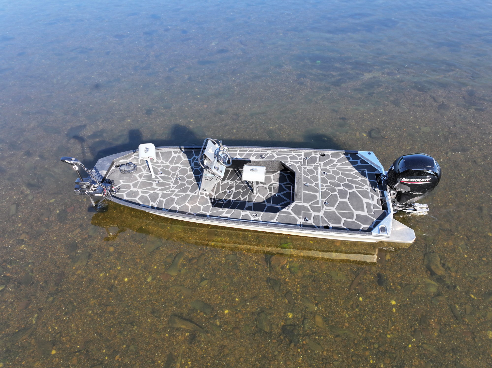 The SR 60 Outboard Jet in clear shallow water over a gravel bottom